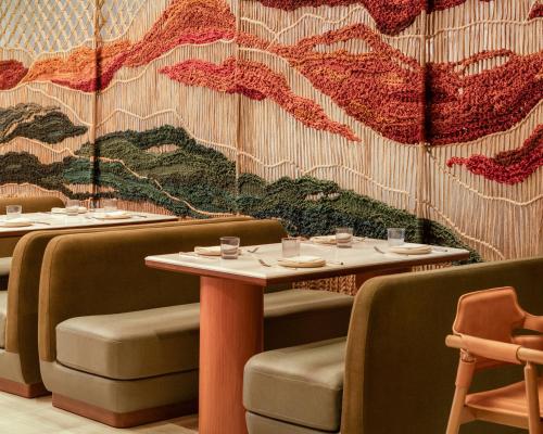 a restaurant with two tables and chairs and a mural at Kimpton Miralina Resort and Villas by IHG in Scottsdale