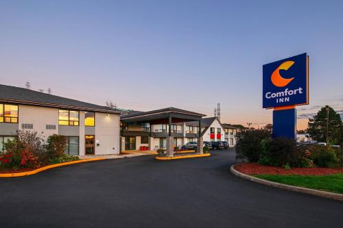 a sign for a comfort inn in a parking lot at Comfort Inn Dartmouth in Halifax