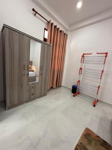 a room with a mirror and a ladder in it at Southern Hight's Villa in Unawatuna