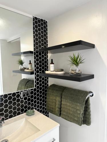 a bathroom with a sink and a mirror at Romantic Stargazing Dome - Beyond Bubbles in Kulnura