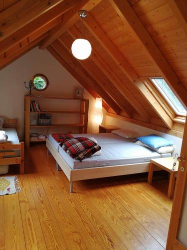 a bedroom with a large bed in a attic at Villa with big garden in Athens
