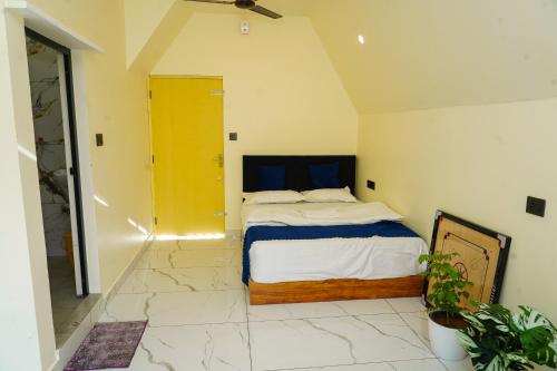 a bedroom with a bed in a room at DreamNest Vagamon in Vagamon