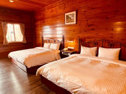 Llit o llits en una habitació de Liching Garden Villa