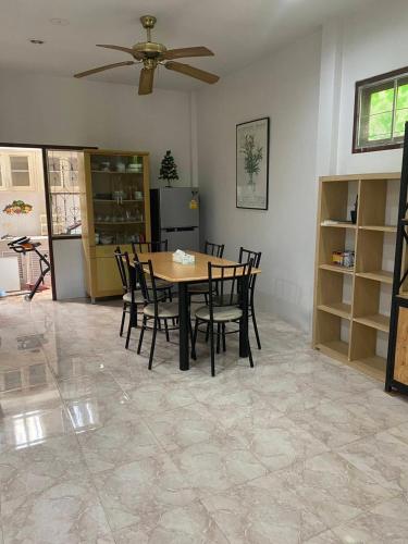 a dining room with a table and chairs at Good Villa by Saran in Krabi