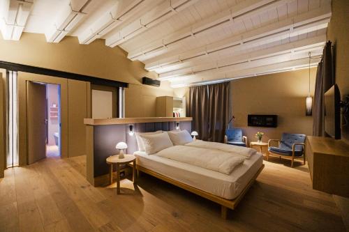 a bedroom with a large bed in a room at Rara Factory Design House in Orvieto