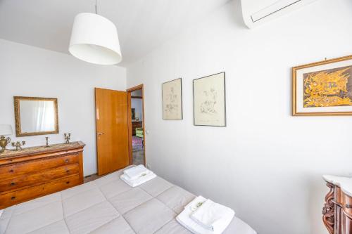 a bedroom with a bed and a sink and a mirror at Italian Experience-Mestrina Apartment in Mestre