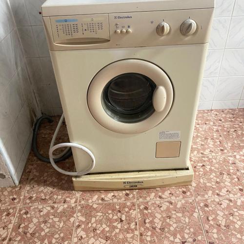 a washing machine sitting on a counter in a bathroom at Good Villa by Saran in Krabi