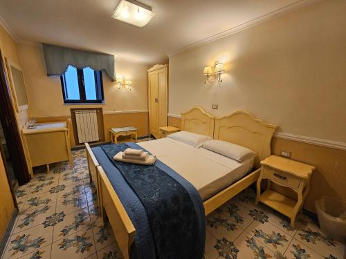 a hotel room with a bed and a window at Le Ninfe Luxury Rooms in Naples