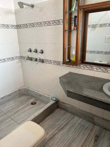 a bathroom with a toilet and a sink at Happy Homes 2BHK Second Floor Panchkula in Panchkula