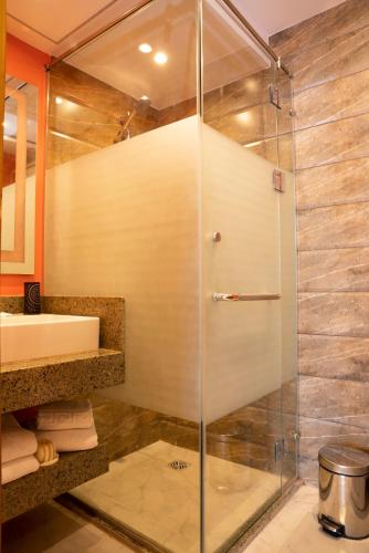 a bathroom with a shower and a sink at Al Dora Boutique Hotel in Hurghada