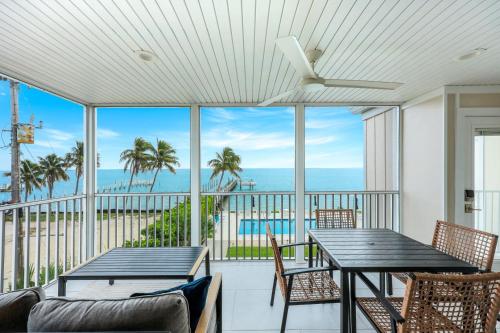 a dining room with a view of the ocean at Captiva Hide A Way 2D in Captiva