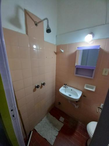 a bathroom with a sink and a toilet at Casona Sol in Mar del Plata