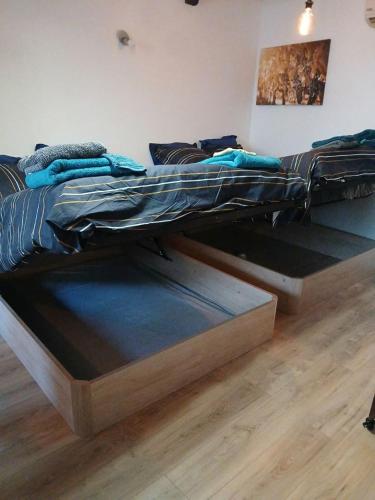 a bed with a wooden frame in a room at Le wine studio Gevrey-Chambertin in Gevrey-Chambertin