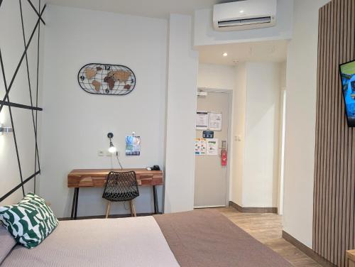 Krevet ili kreveti u jedinici u okviru objekta H33 Hôtel