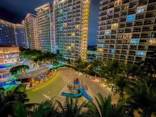 a view of a resort at night with a water park at Casa Del Sol in Manila