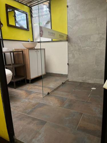 a bathroom with a shower and a sink at GLAMPING RESERVA CATEDRAL Zipaquira in Zipaquirá