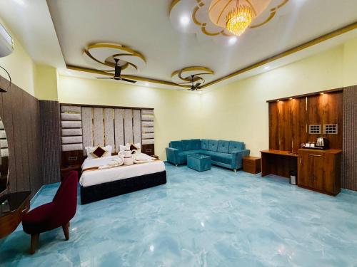 a large room with a bed and a couch at Hotel Diamond Crest, Patna in Patna