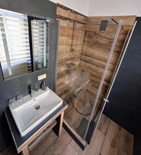a bathroom with a sink and a shower at GuestNest-Erfurt in Erfurt
