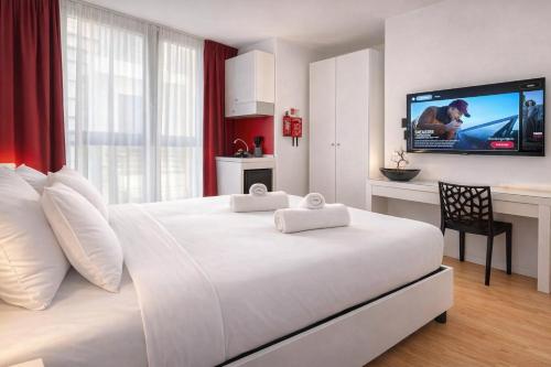 Postelja oz. postelje v sobi nastanitve Citizen Suites