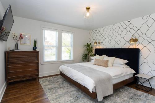 a bedroom with a large bed and a window at Top Walk score! Prime Westport Midtown Location! in Kansas City