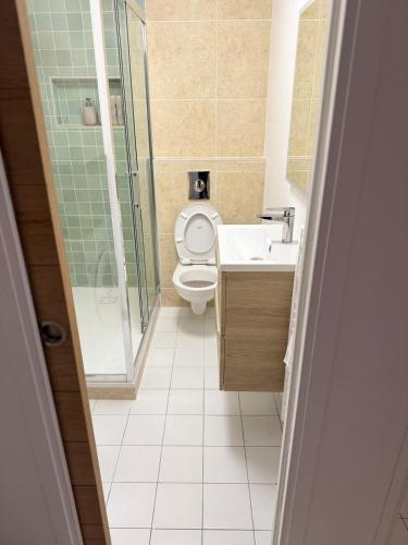 a bathroom with a toilet and a sink and a shower at Le Matin bohème Paris- Orly- By Chozen in Épinay-sur-Orge