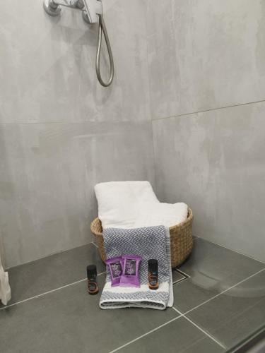a bathroom with a chair in a shower at Villa Katerina in Chania