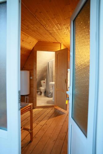 a room with a bathroom with a toilet and a door at Black Castle Red Valley in Sevaberd