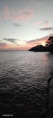 a view of a large body of water at sunset at Rancho Morgan in San Lázaro