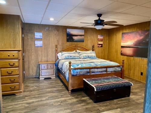 a bedroom with a bed and a ceiling fan at Lake Oconee Waterfront Apartment in Greensboro