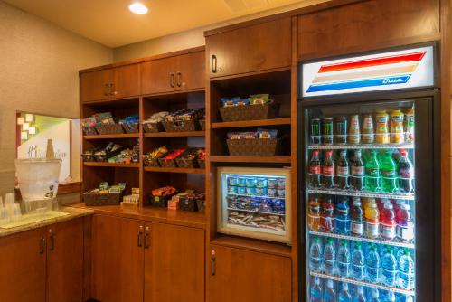 a refrigerator filled with lots of different types of drinks at Holiday Inn Steamboat Springs by IHG in Steamboat Springs