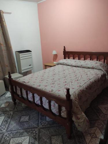 a bedroom with a bed and a table with a lamp at Las Tres Reinas A in Colorado River