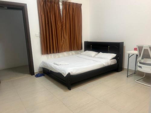 a small bed in a room with a window at doge villa 7 in Dubai