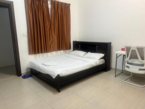 a bed in a room with a window and a table at doge villa 7 in Dubai