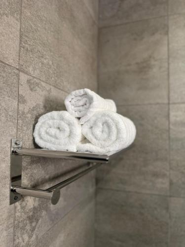 a towel rack in a bathroom with two towels at Europa Point Area Townhouse in Gibraltar