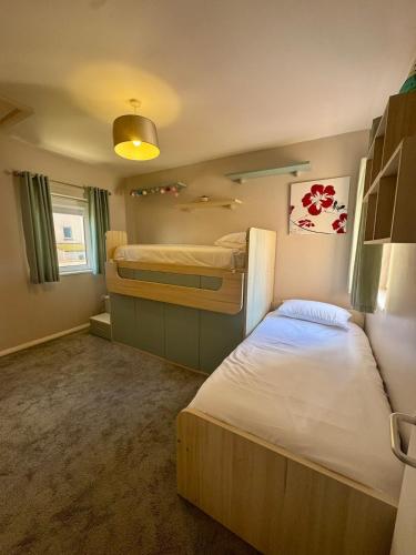 a bedroom with two bunk beds in a room at Europa Point Area Townhouse in Gibraltar