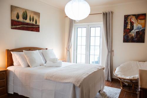 En eller flere senge i et værelse på Anjo House