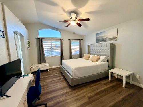 a bedroom with a bed and a ceiling fan at Oasis pool house, optional pool heater in Las Vegas