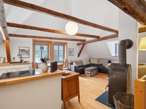a kitchen and living room with wooden beams at Kaffeemühle Hamma I in Heringen
