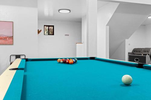 a pool table with balls on it in a room at Stop Looking You've found it in Volcano