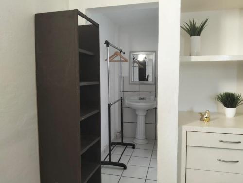 a bathroom with a toilet and a sink at Sierra 5 in Acapulco
