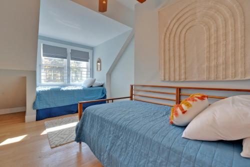a bedroom with a bed and a window at Tidepools Retreat Poolside Family Fun in York