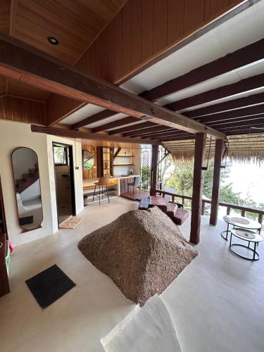 a living room with a couch and a table at Suncliff Resort in Haad Rin