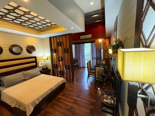 a bedroom with a bed and a living room at Pico De Loro Miranda B With Converge Wifi, See all photos first before booking in Nasugbu