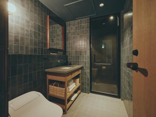 a bathroom with a toilet and a sink and a shower at mont - Nozawa Onsen Ski Resort in Nozawa Onsen