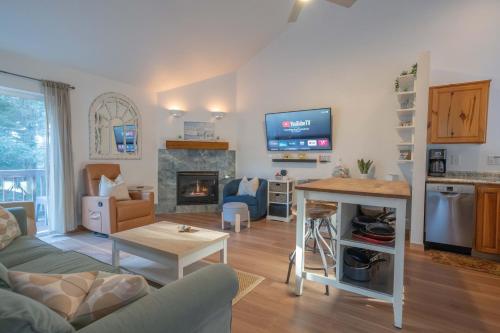 a living room with a couch and a fireplace at Tolovana 3 Cannon Beach in Cannon Beach