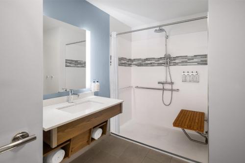 a bathroom with a sink and a shower at EVEN Hotel Pittsburgh Downtown by IHG in Pittsburgh