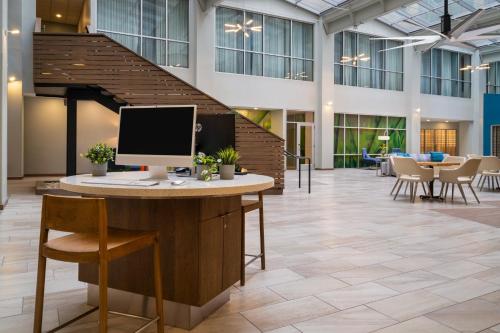 an office with a desk with a computer on it at EVEN Hotel Pittsburgh Downtown by IHG in Pittsburgh