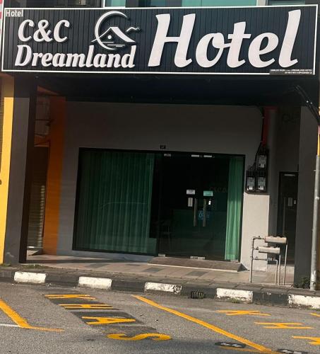 a hotel sign on the front of a building at C&CDreamland hotel in Ipoh