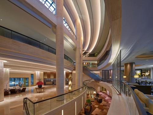 an image of a lobby with a large ceiling at New World Millennium Hong Kong Hotel in Hong Kong