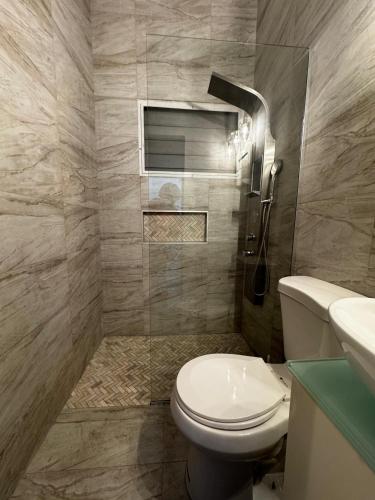 a bathroom with a toilet and a sink at Grandma House in Carolina